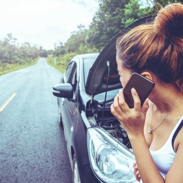 endurance, extended car warranty, car trouble, breakdown, woman on the phone, road